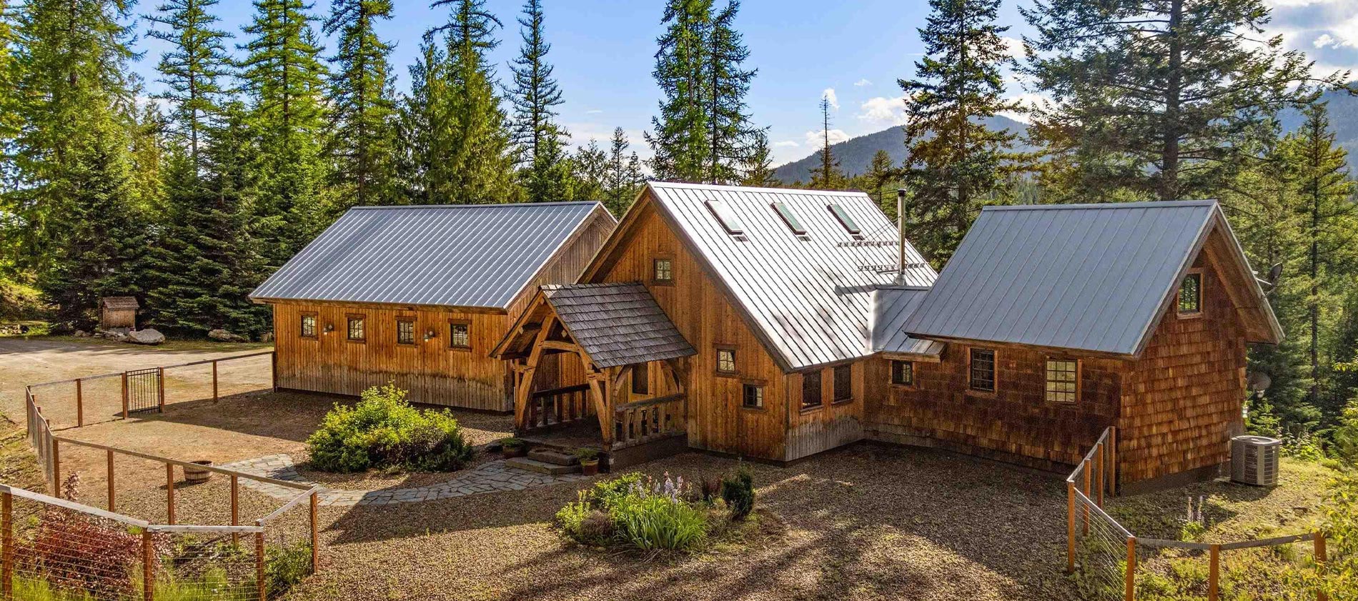 complete privacy are yours in this stunning timber-frame home with separate shop on 20.83 acres