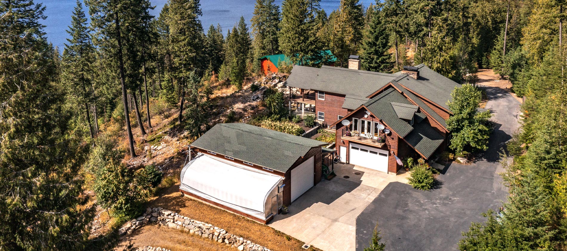 One-of-a-kind custom home on 13 acres (2 separate lots) overlooking the pristine waters of Priest Lake