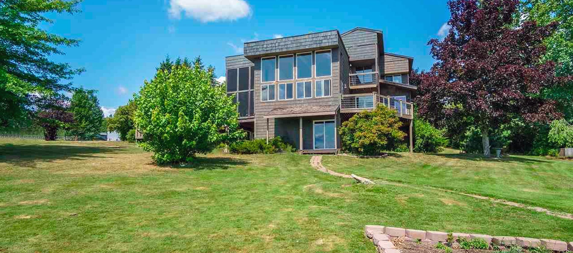 This beautiful property, set upon 400' of gentle sloped south facing shore of Lake Pend Orielle